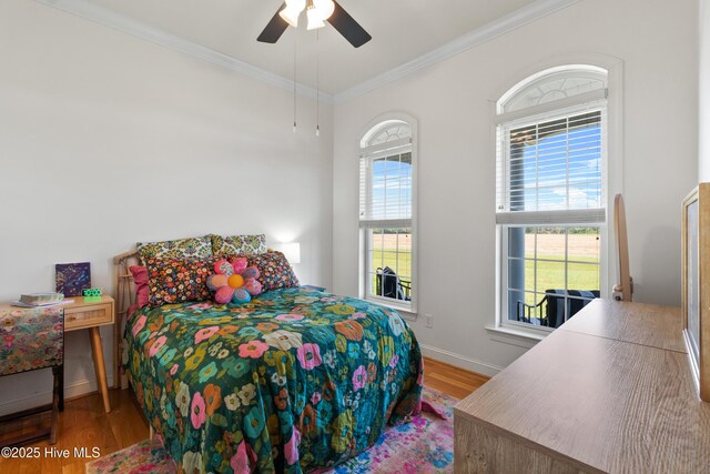 103 Arabian Cir, Beulaville, NC 28518 - bedroom with wood finished floors, baseboards, ornamental molding, and ceiling fan