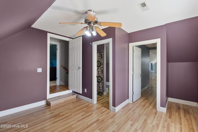 103 Arabian Cir, Beulaville, NC 28518 - unfurnished bedroom with light wood finished floors, vaulted ceiling, baseboards, and a ceiling fan