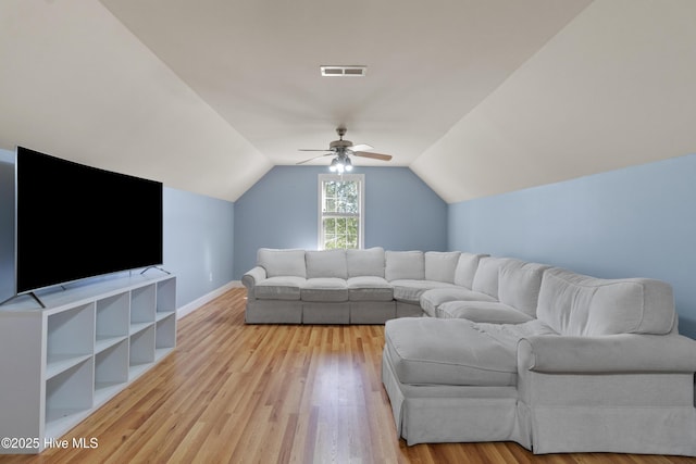 103 Arabian Cir, Beulaville, NC 28518 - living room featuring a ceiling fan, vaulted ceiling, light wood-style floors, and baseboards
