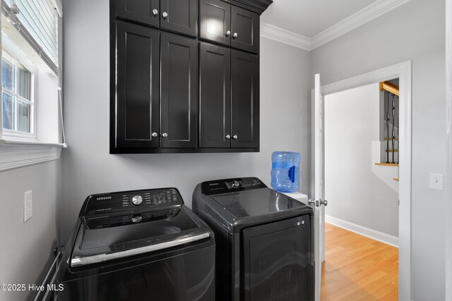 103 Arabian Cir, Beulaville, NC 28518 - laundry room featuring washer and dryer, cabinet space, crown molding, light wood-style flooring, and baseboards