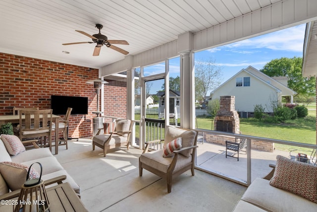 103 Arabian Cir, Beulaville, NC 28518 - sunroom featuring an outdoor living space with a fireplace and a ceiling fan