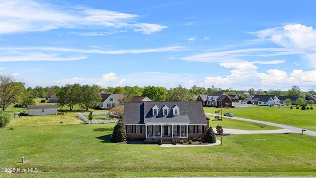 103 Arabian Cir, Beulaville, NC 28518 - view of front of property featuring a porch, brick siding, a front lawn, and a residential view
