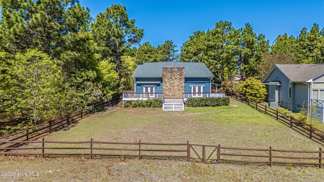 124 Shenandoah Rd E, West End, NC 27376 - view of front of house featuring a deck