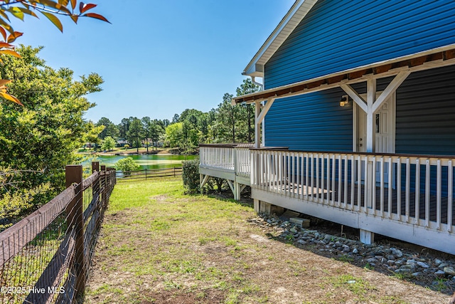124 Shenandoah Rd E, West End, NC 27376 - view of yard featuring a deck with water view