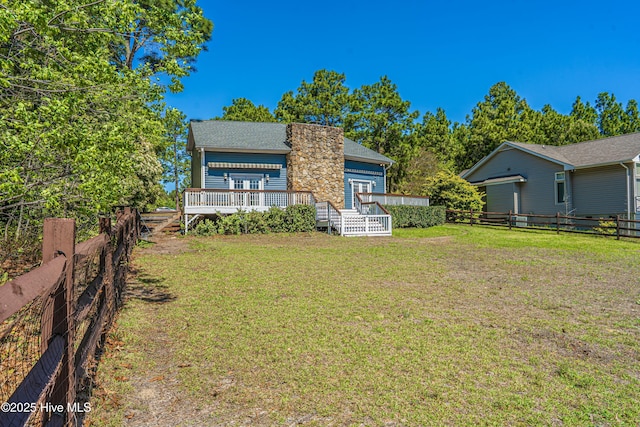 124 Shenandoah Rd E, West End, NC 27376 - rear view of house featuring a wooden deck