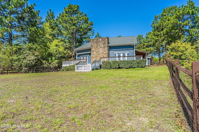 124 Shenandoah Rd E, West End, NC 27376 - back of property with a wooden deck