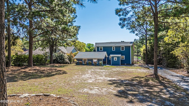 124 Shenandoah Rd E, West End, NC 27376 - rear view of house with a yard