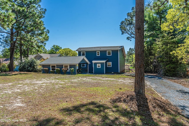 124 Shenandoah Rd E, West End, NC 27376 - view of front facade featuring a front lawn