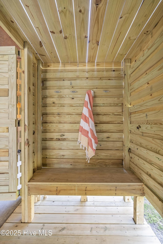231 Sand Piper Dr, North Topsail Beach, NC 28460 - mudroom featuring a sauna / steam room, wooden ceiling, and wooden walls