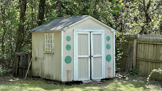 view of shed featuring a fenced backyard