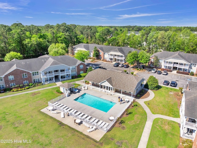 aerial view of residential area featuring a pool