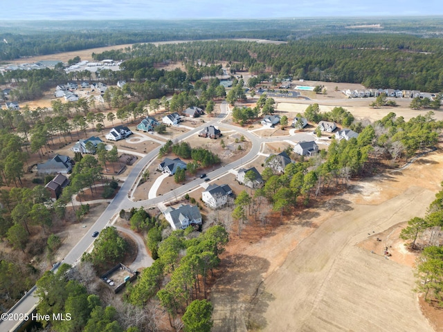 aerial view with a forest view and a residential view