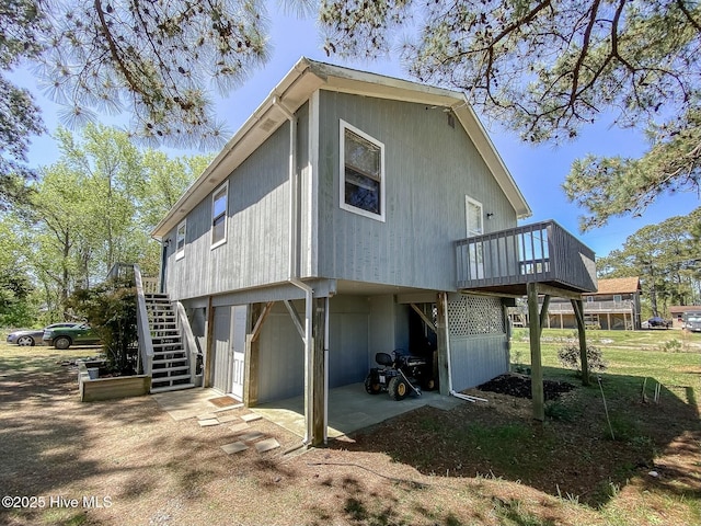 105 Blue Heron Rd, Shiloh, NC 27974 - rear view of house with stairway and a deck