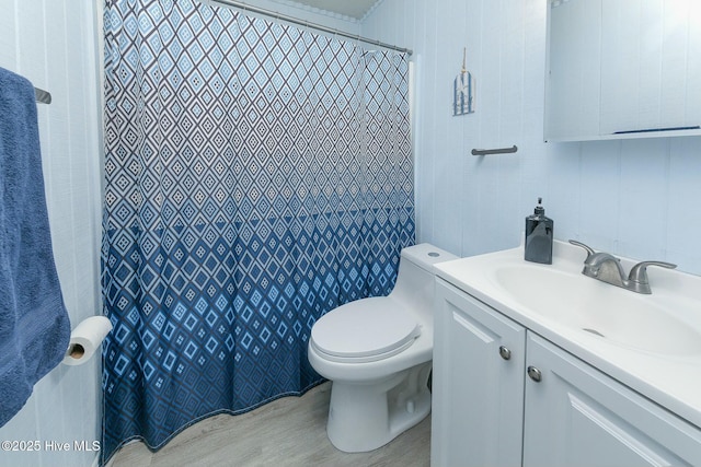 105 Blue Heron Rd, Shiloh, NC 27974 - full bathroom with toilet, vanity, wood finished floors, and a shower with shower curtain