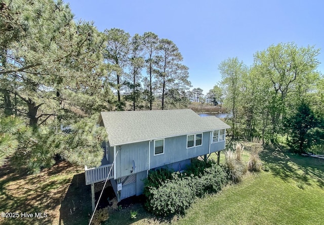 105 Blue Heron Rd, Shiloh, NC 27974 - view of side of home with roof with shingles and view of scattered trees