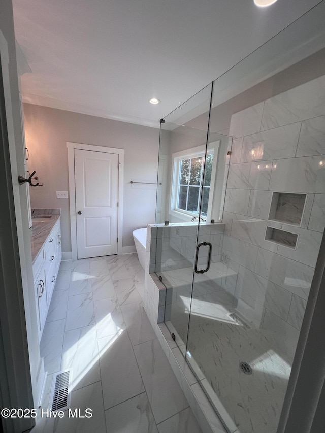 3216 Whichards Beach Rd, Chocowinity, NC 27817 - full bathroom with marble look tile flooring, a soaking tub, vanity, a shower stall, and recessed lighting