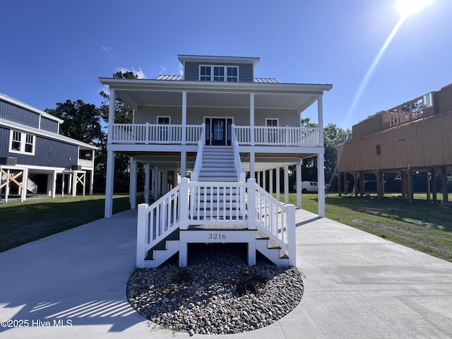 3216 Whichards Beach Rd, Chocowinity, NC 27817 - beach home with a porch, concrete driveway, stairway, metal roof, and a carport