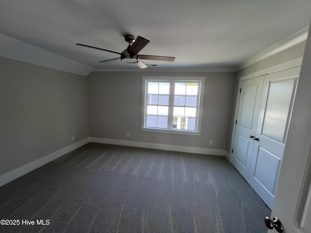 3216 Whichards Beach Rd, Chocowinity, NC 27817 - unfurnished bedroom featuring baseboards, dark carpet, lofted ceiling, and ceiling fan