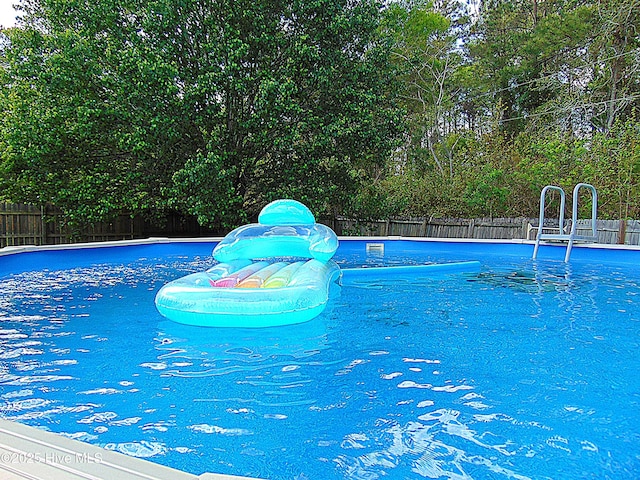 view of pool featuring a fenced backyard and a fenced in pool