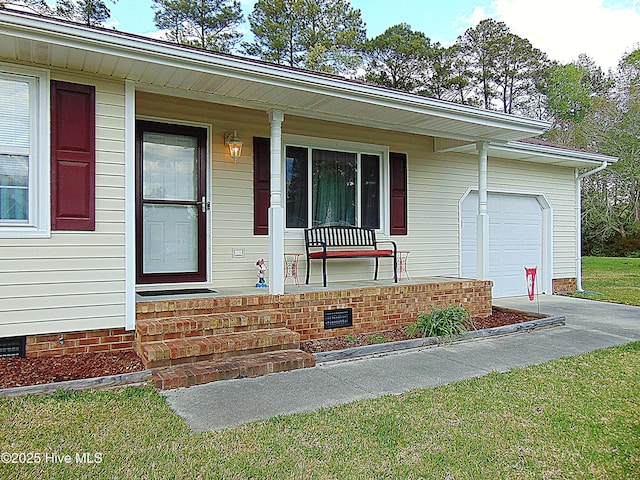 property entrance featuring an attached garage, covered porch, and crawl space
