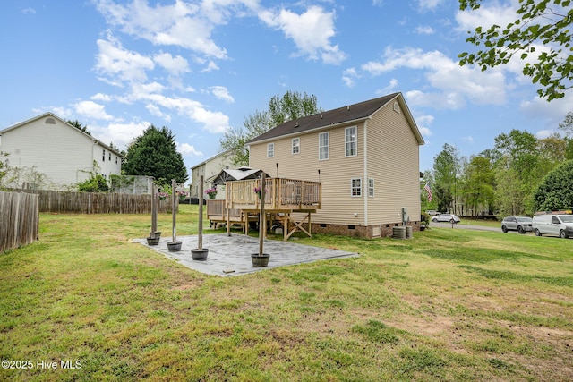 back of house featuring crawl space, a yard, a patio, fence, and a gazebo