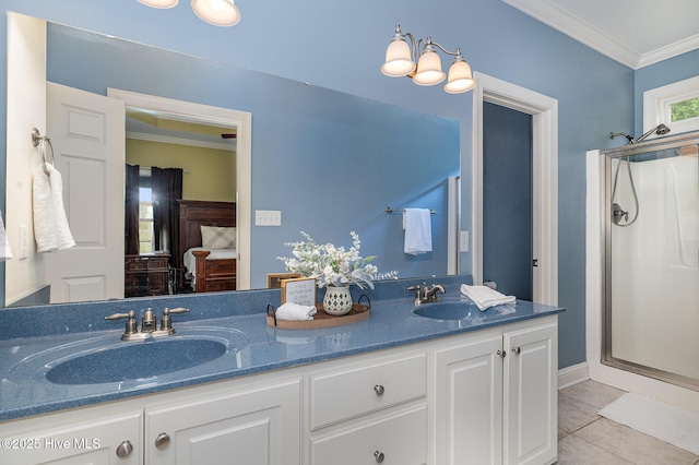 full bath with a stall shower, double vanity, a sink, and ornamental molding