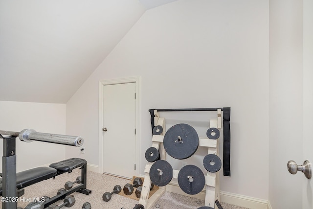 workout area with carpet floors, baseboards, and lofted ceiling