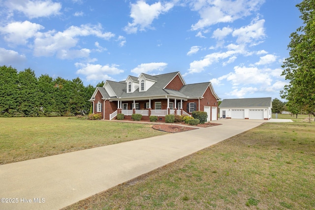 cape cod house with a porch, driveway, a front lawn, and brick siding