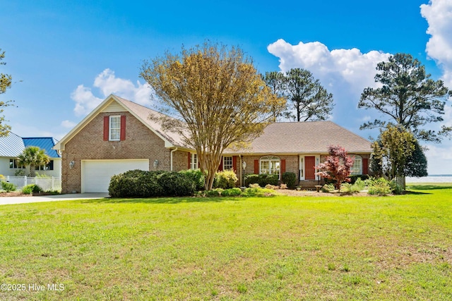 6042 Dolphin Rd, Oriental, NC 28571 - view of front of home with brick siding, an attached garage, driveway, and a front yard