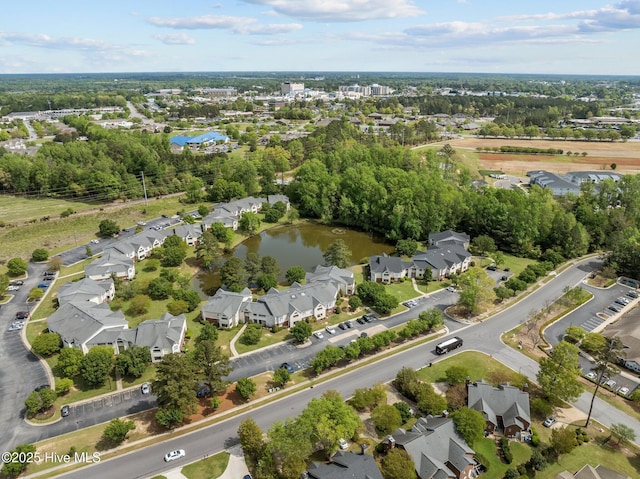 birds eye view of property featuring a water view and a residential view