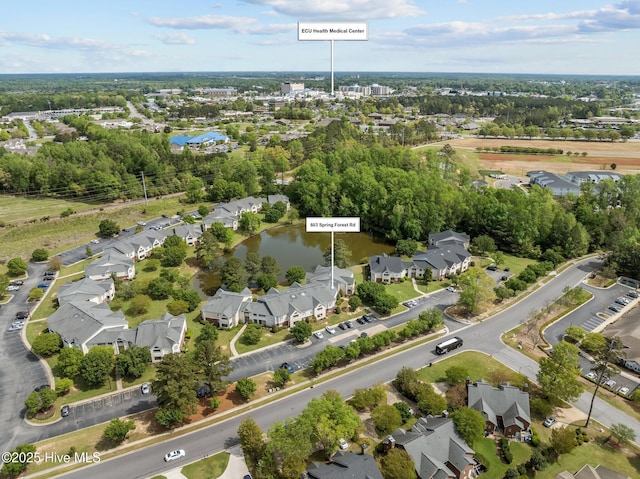 birds eye view of property with a residential view and a water view