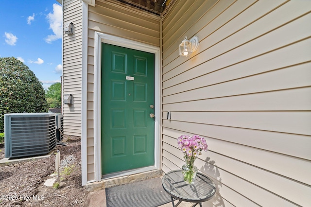 entrance to property featuring central AC