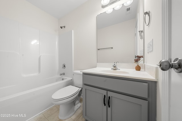 bathroom with visible vents, toilet, vanity, tile patterned floors, and bathing tub / shower combination