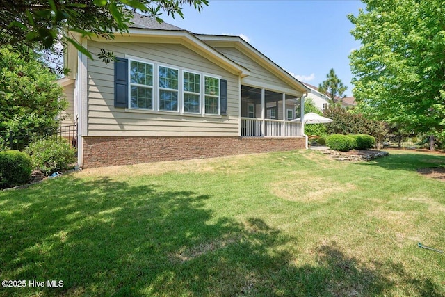 104 Old Club House Ln, Southern Pines, NC 28387 - back of property with a lawn, fence, and a sunroom