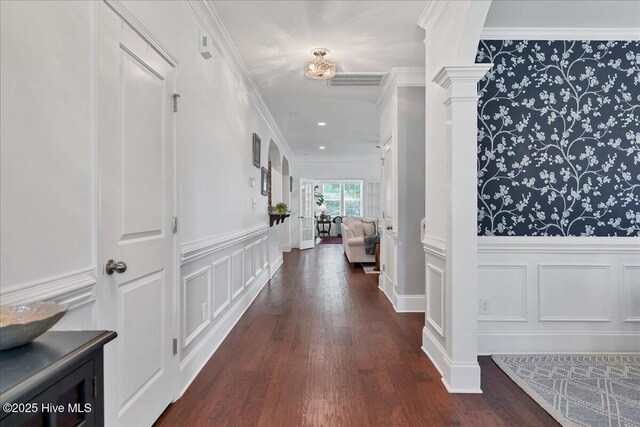 104 Old Club House Ln, Southern Pines, NC 28387 - hallway with wainscoting, a decorative wall, dark wood-style flooring, and visible vents