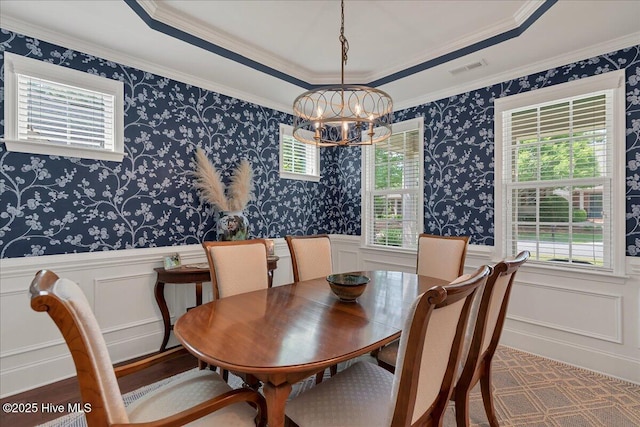104 Old Club House Ln, Southern Pines, NC 28387 - dining space featuring visible vents, a wainscoted wall, a chandelier, ornamental molding, and a decorative wall