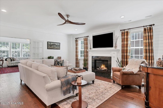 104 Old Club House Ln, Southern Pines, NC 28387 - living room featuring a premium fireplace, ceiling fan, dark wood finished floors, and ornamental molding