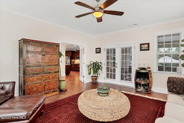 104 Old Club House Ln, Southern Pines, NC 28387 - living area with ceiling fan, crown molding, arched walkways, wood finished floors, and baseboards