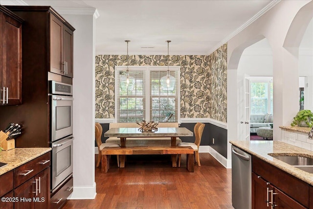 104 Old Club House Ln, Southern Pines, NC 28387 - kitchen with appliances with stainless steel finishes, a sink, baseboards, wallpapered walls, and dark wood-type flooring