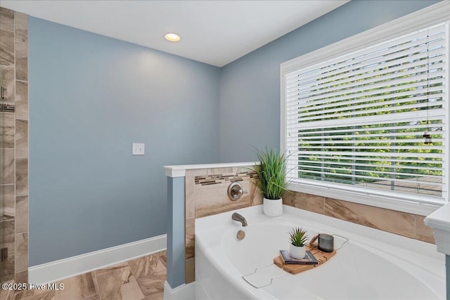 104 Old Club House Ln, Southern Pines, NC 28387 - full bath featuring a bath, baseboards, a healthy amount of sunlight, and marble finish floor