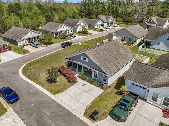 birds eye view of property with a residential view