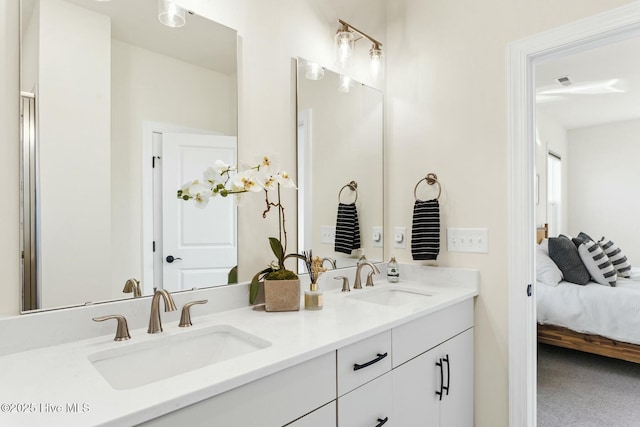 ensuite bathroom featuring a sink, ensuite bathroom, and double vanity