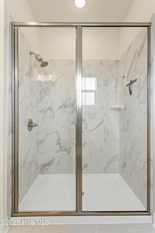 bathroom with a shower stall
