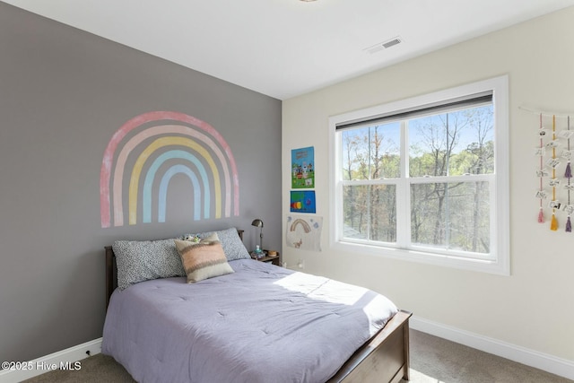 bedroom featuring visible vents, baseboards, and carpet flooring