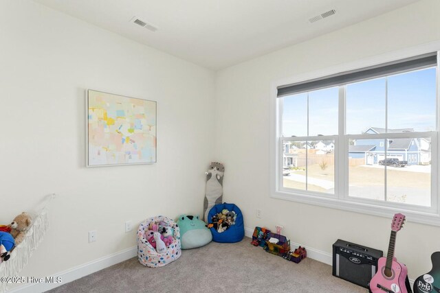 playroom with visible vents, plenty of natural light, and carpet flooring