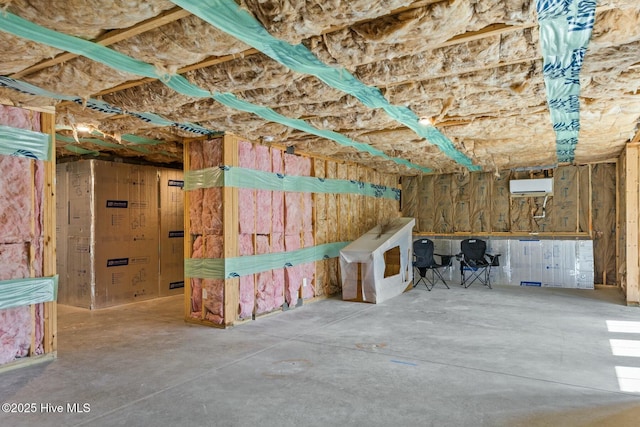 basement featuring an AC wall unit