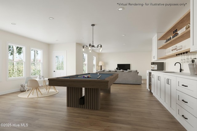 game room featuring recessed lighting, wood finished floors, pool table, and a sink