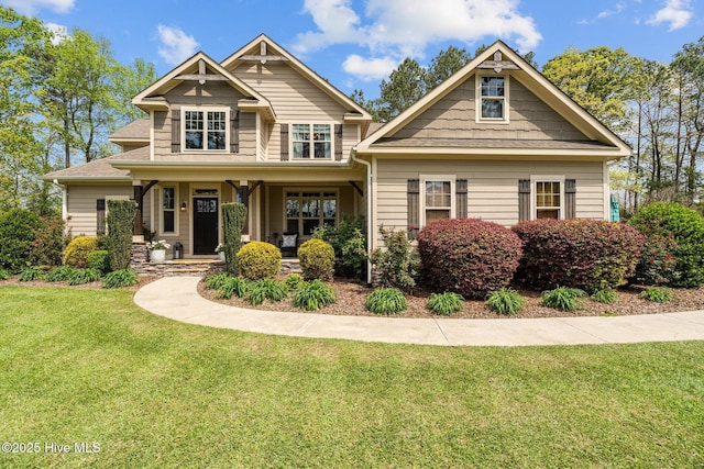 view of front of house featuring a front yard and covered porch