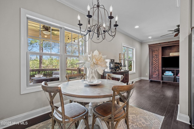 dining area with baseboards, recessed lighting, crown molding, dark wood-type flooring, and ceiling fan with notable chandelier
