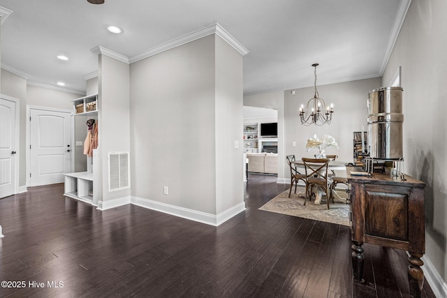 foyer with a chandelier, dark wood-style flooring, baseboards, and visible vents